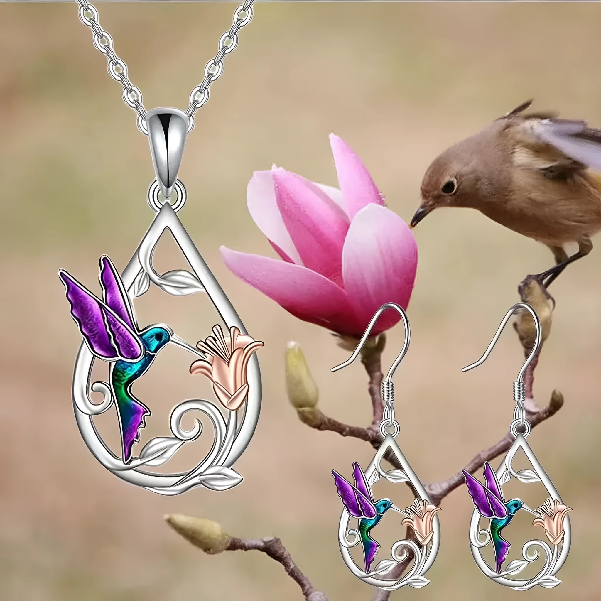 White electroplated copper hummingbird necklace and earring set with animal motifs on a neutral background