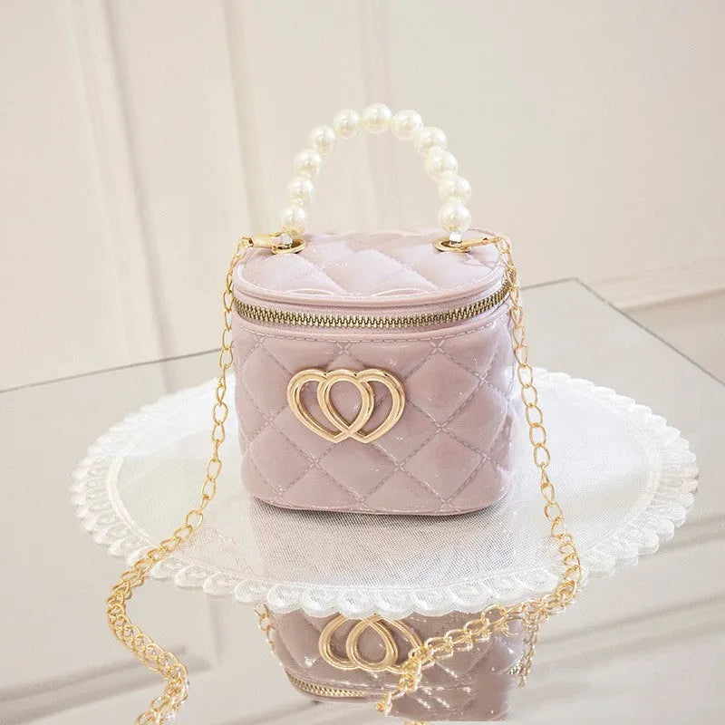 White PVC bucket-shaped gel bag with a heart pattern visible inside the open top.