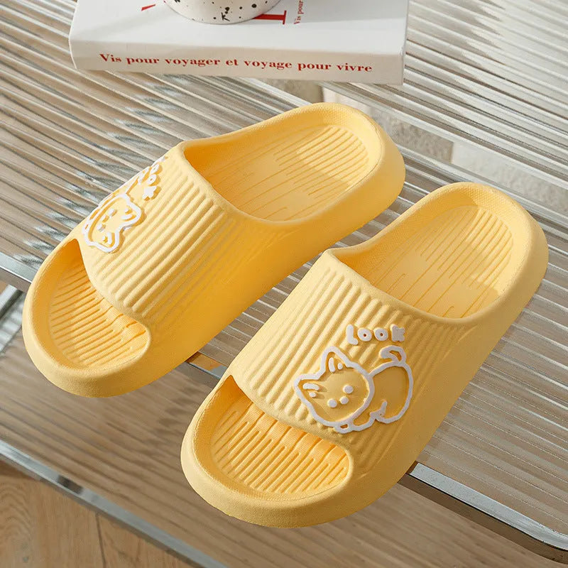 Green EVA platform flip flop slippers with a raised cat design on the upper.
