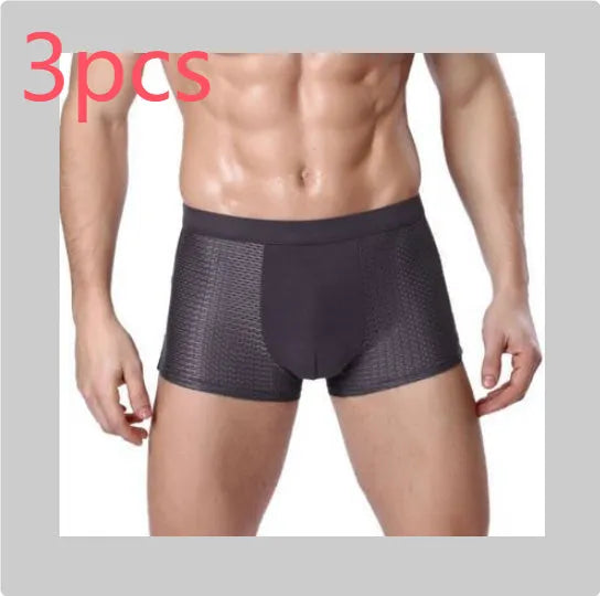 Men's solid colour ice silk modal boxer briefs showing U convex design on a mid waist.