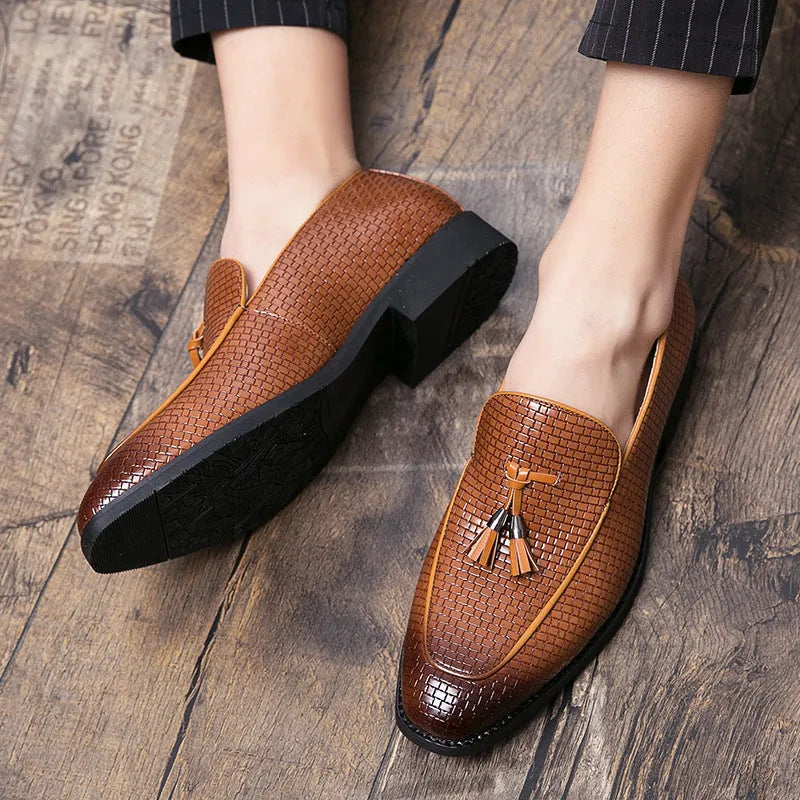 Men's black pointed slip-on business shoes with tassel detail on artificial PU leather upper