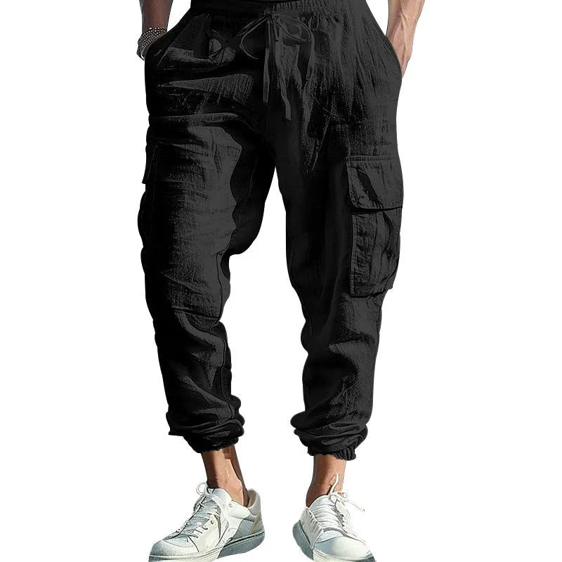 Men's solid colour linen casual trousers with ankle-tied cuffs, multiple pockets, and a drawstring waist
