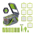 Grey multifunctional vegetable cutter with stainless steel blades, foldable compartments, and a large container on a kitchen counter