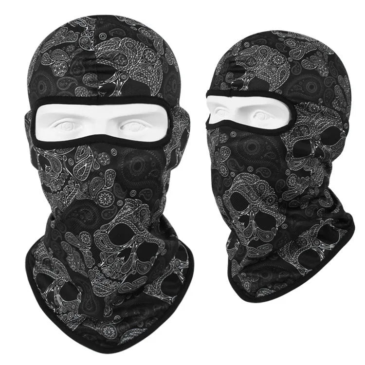 Breathable Bakool silk motorcycle skull mask in a graphic design, laid flat showing its 36cm by 29cm size.