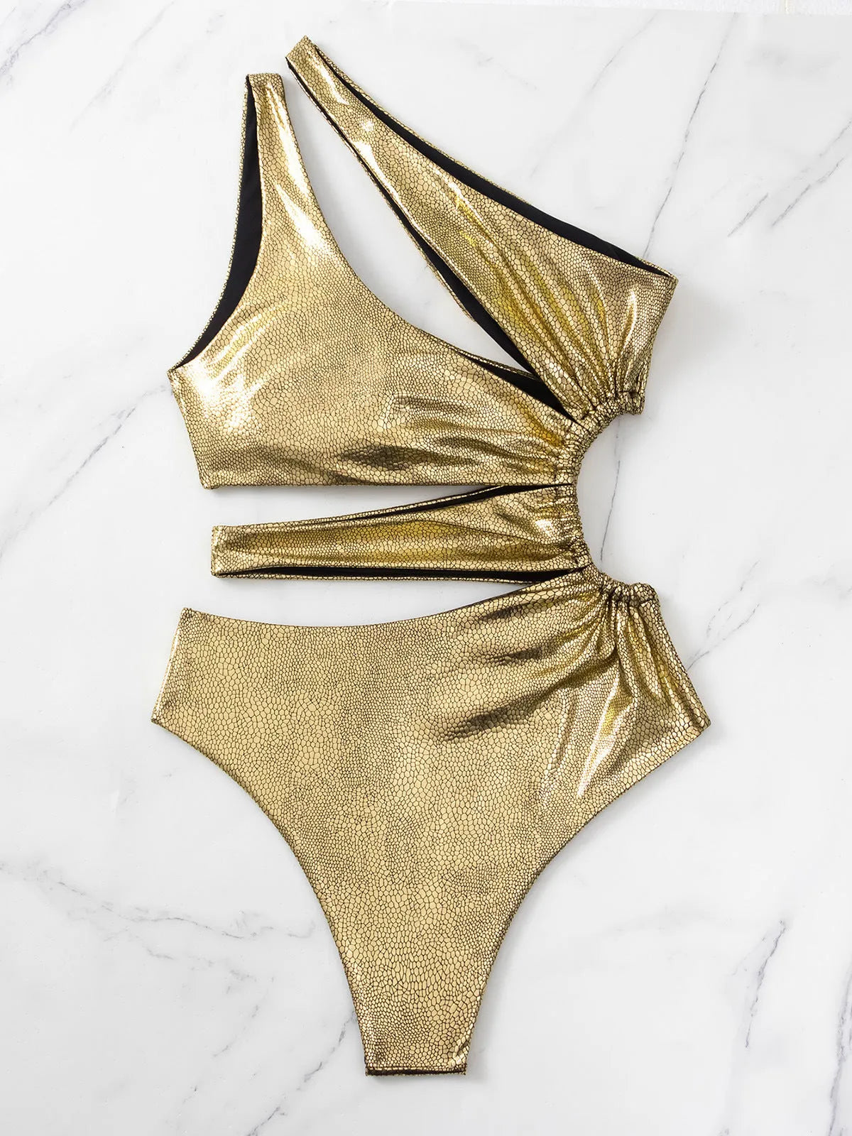 Women's one-piece swimsuit in gold colour with backless design and sleeveless cut