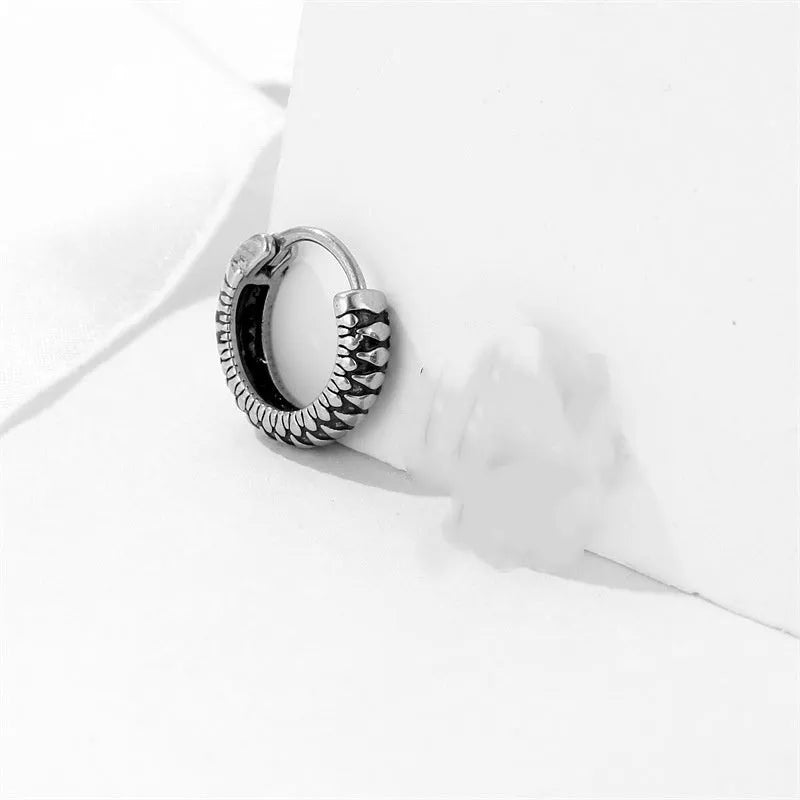 Silver geometric stud earrings with a retro striped twist pattern, made from titanium steel.