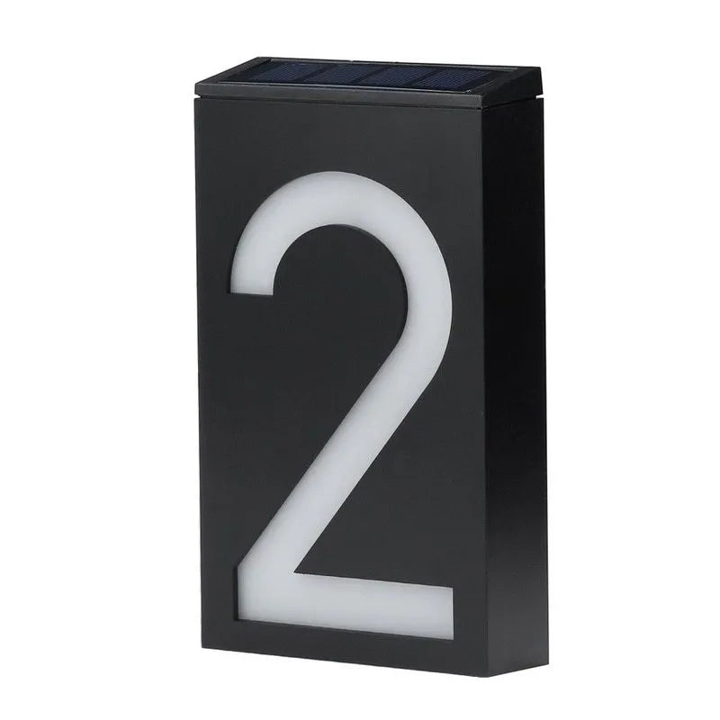 Solar powered white LED house number light mounted on a wall with IP65 waterproof rating