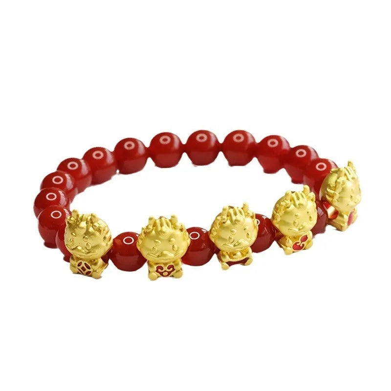 Close-up of 8mm red agate bracelet with carved Five Blessings Dragon design on wrist.