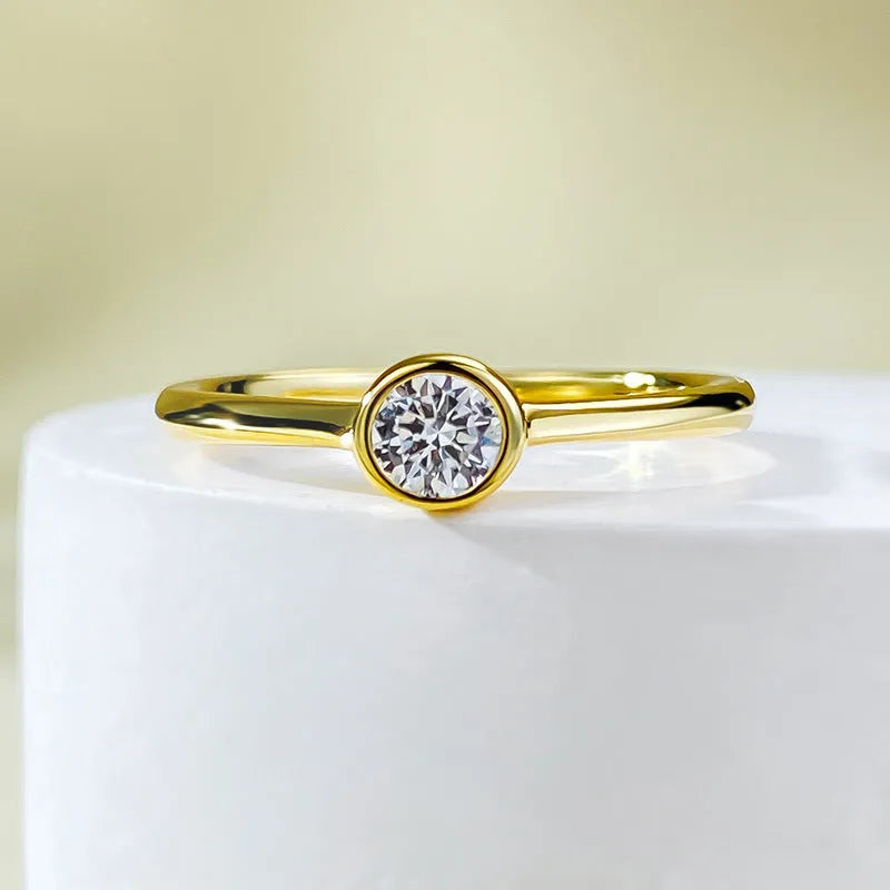 Minimalist crown-shaped silver ring with linear details, shown in gold and platinum electroplated finishes.