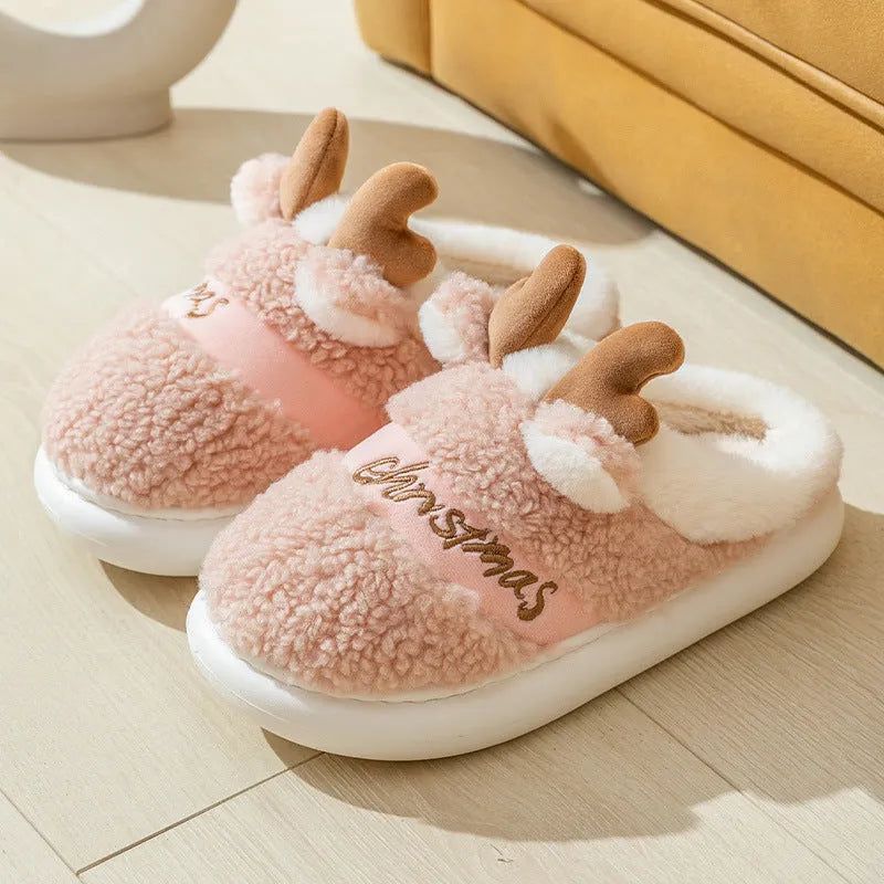 Pair of Christmas elk winter home slippers with suede upper, available in candy colours