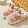Pair of Christmas elk winter home slippers with suede upper, available in candy colours
