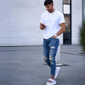 Men's deep blue cotton jeans laid flat, showing classic denim texture and five-pocket design.