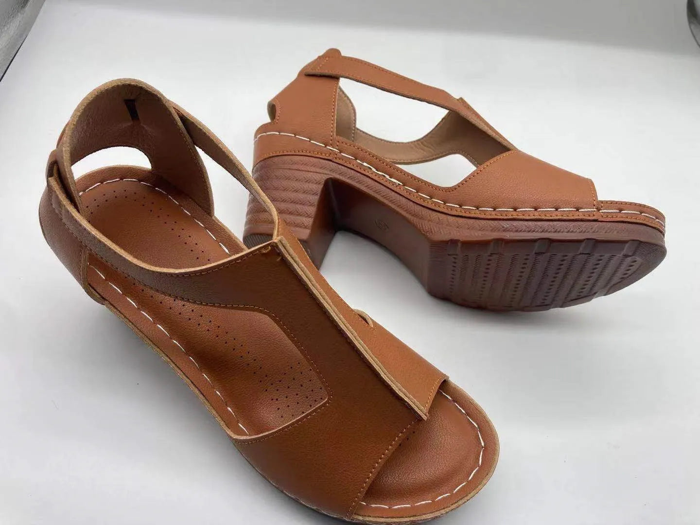 Plus size women's wedge sandals with peep toe, Roman buckle detail, and fish mouth design