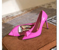 Pink patent leather women's pointed toe stiletto heels with buckle detailing