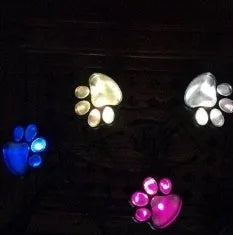 Black bear paw-shaped solar garden lights with solar panel pole for outdoor pathway illumination