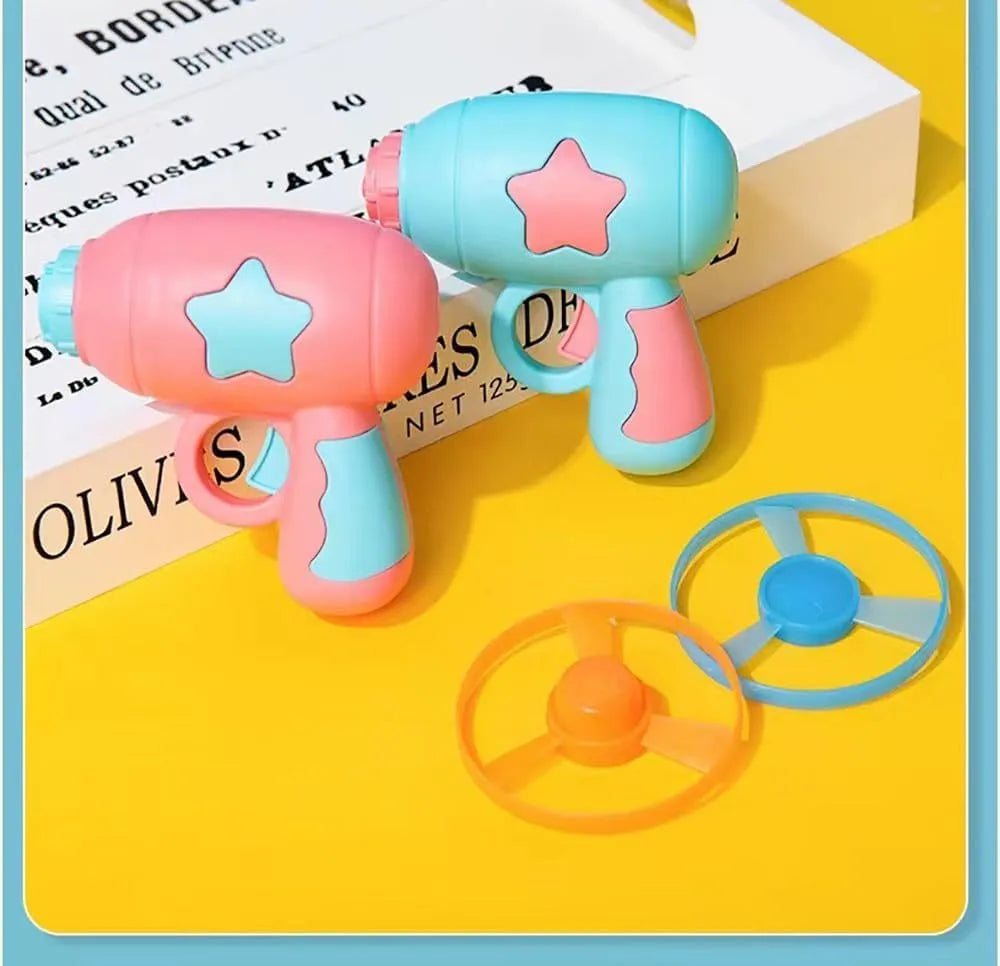 Blue or pink plastic cat toy gun with frisbee launcher for indoor feline play