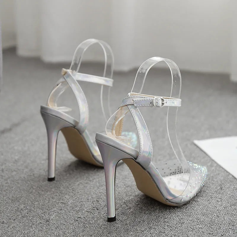 Women's pointed toe diamond sandals with stiletto heels on a white background.