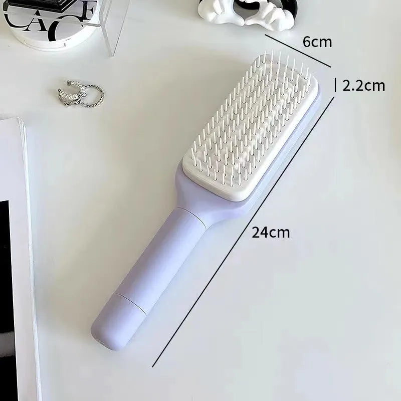 Roland purple and lunar rock grey self-cleaning hair brush with anti-static massage comb teeth.