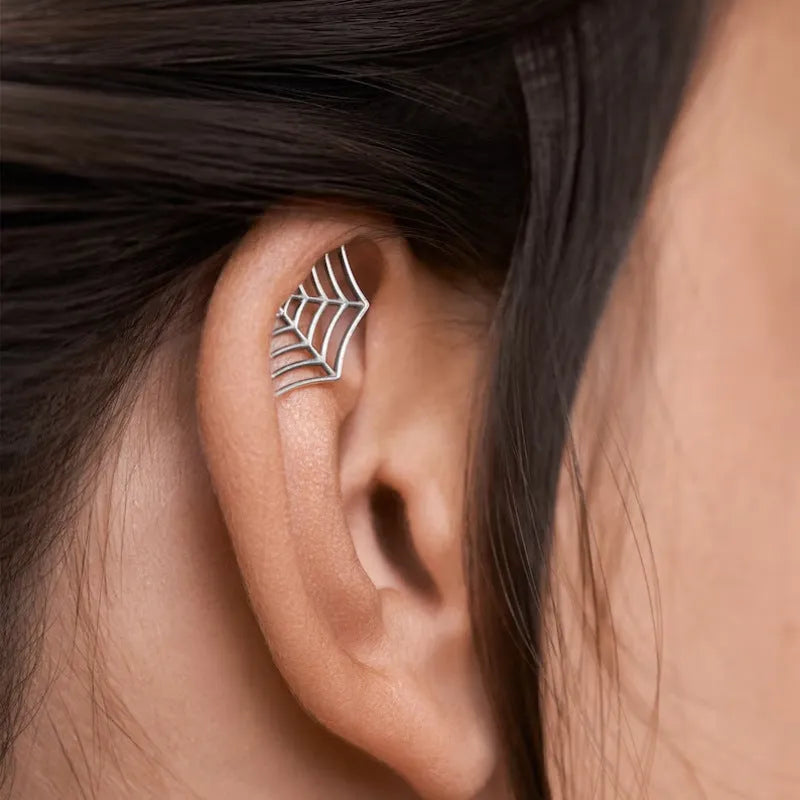 Geometric spider web stud earrings with mesh design in electroplated gold or silver metal finish.