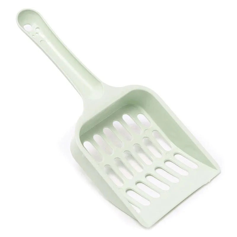 Blue plastic cat litter scoop on a white background