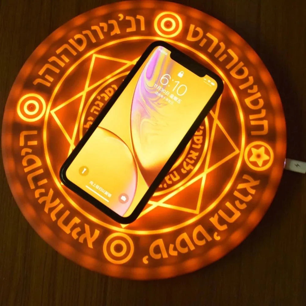 Square wireless phone charger with magic array pattern showing black colour option on desk surface