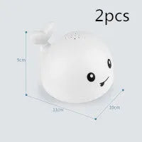 Automatic water spray whale bath toy with colourful LED lights floating in baby bath
