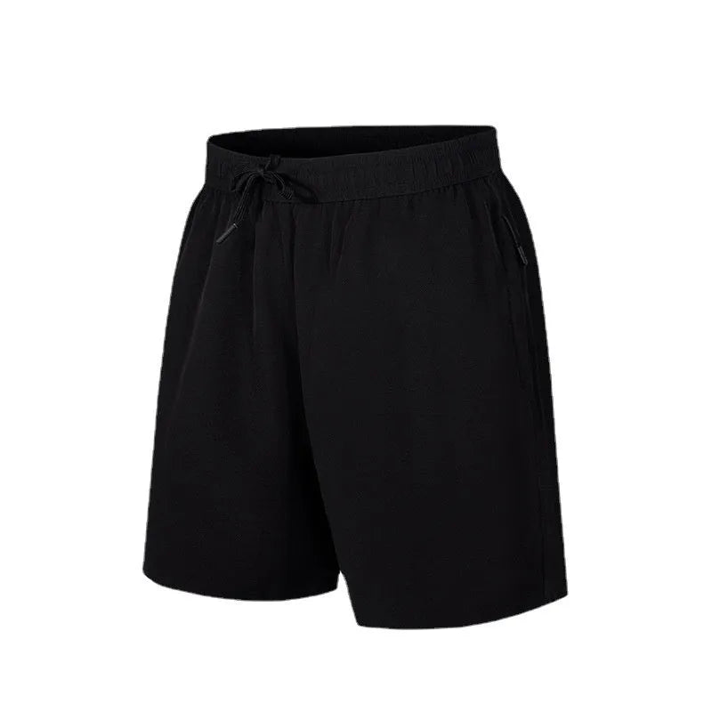 Men's loose fit quick-drying sports shorts in polyester fabric for summer activities