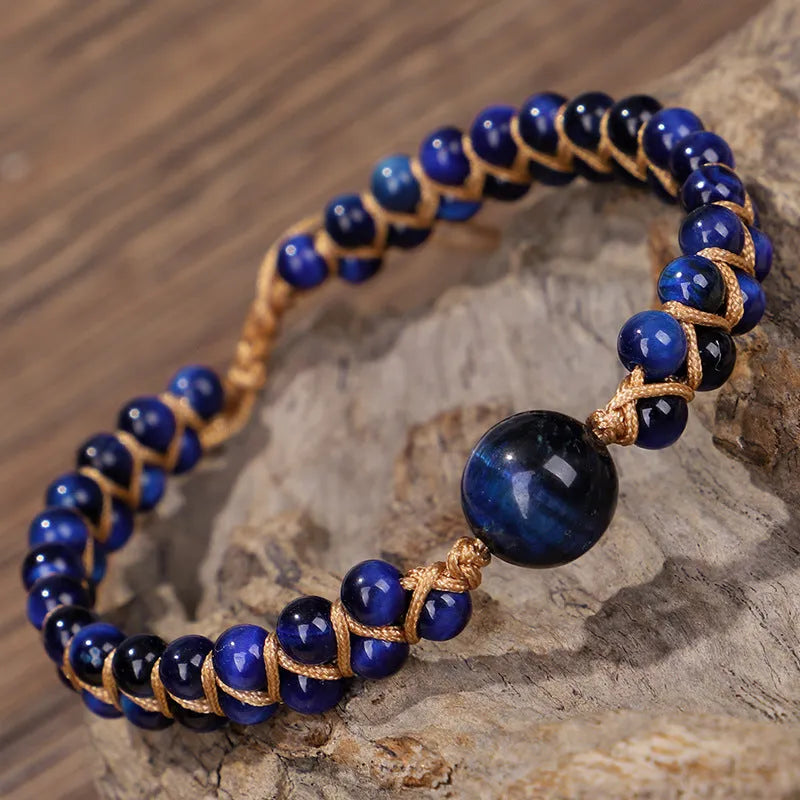 Handmade woven geometric pull bracelet in blue tigereye stone with adjustable closure.