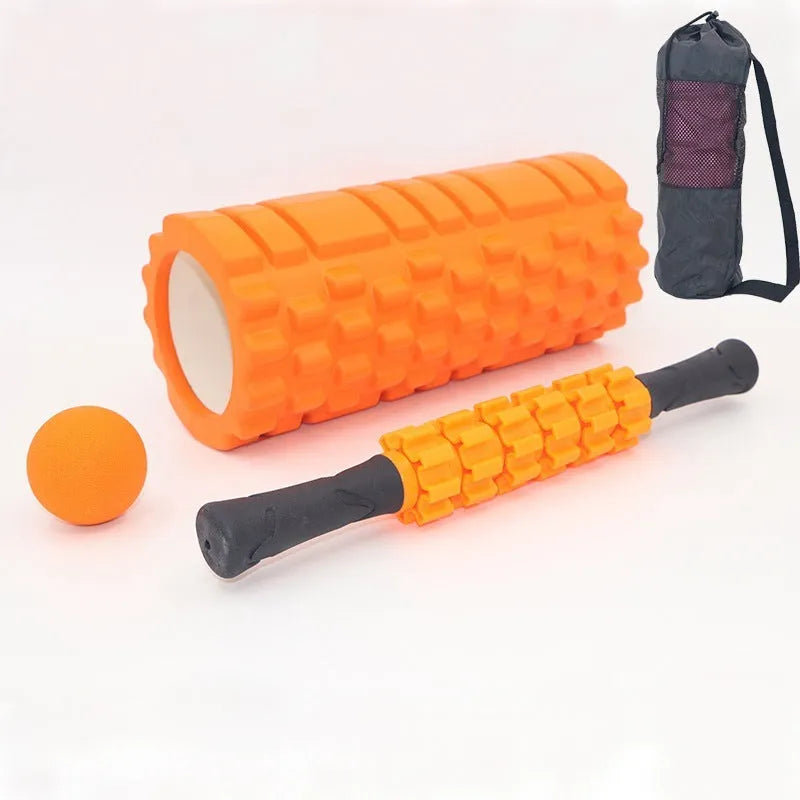 33cm long black foam roller massage stick with six raised gear pieces along its shaft.