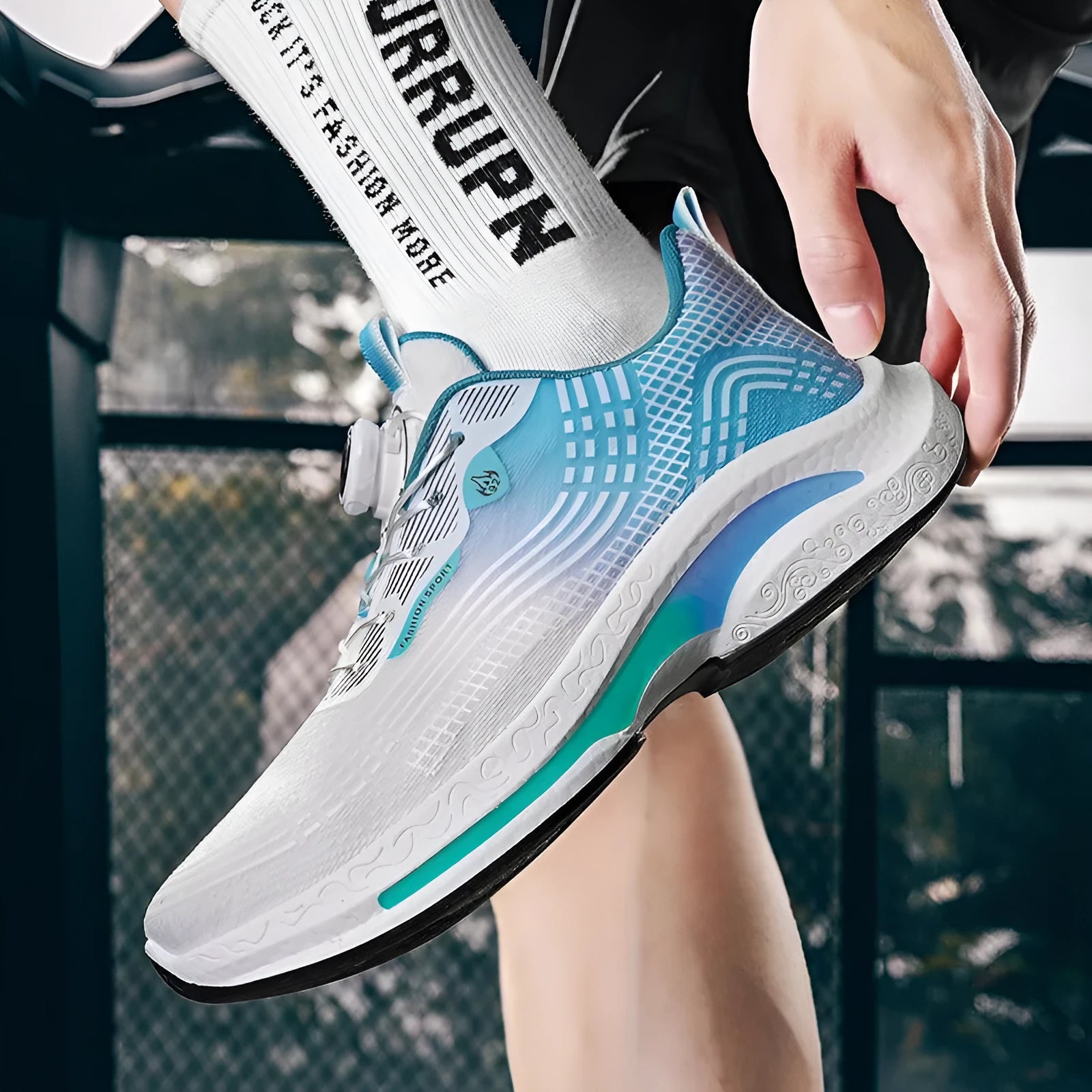 Men's low-top sneaker with mesh lining and a rotating buckle closure on a rubber sole.