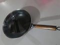 Traditional black iron wok pan with wooden handle measuring 40cm