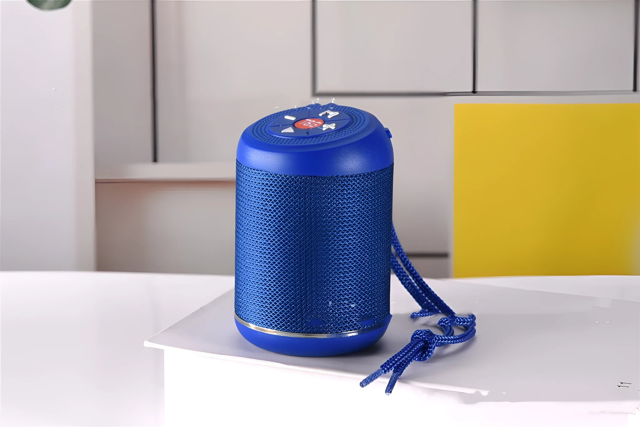 Portable outdoor Bluetooth subwoofer in black with button controls for radio, calls, and playback modes