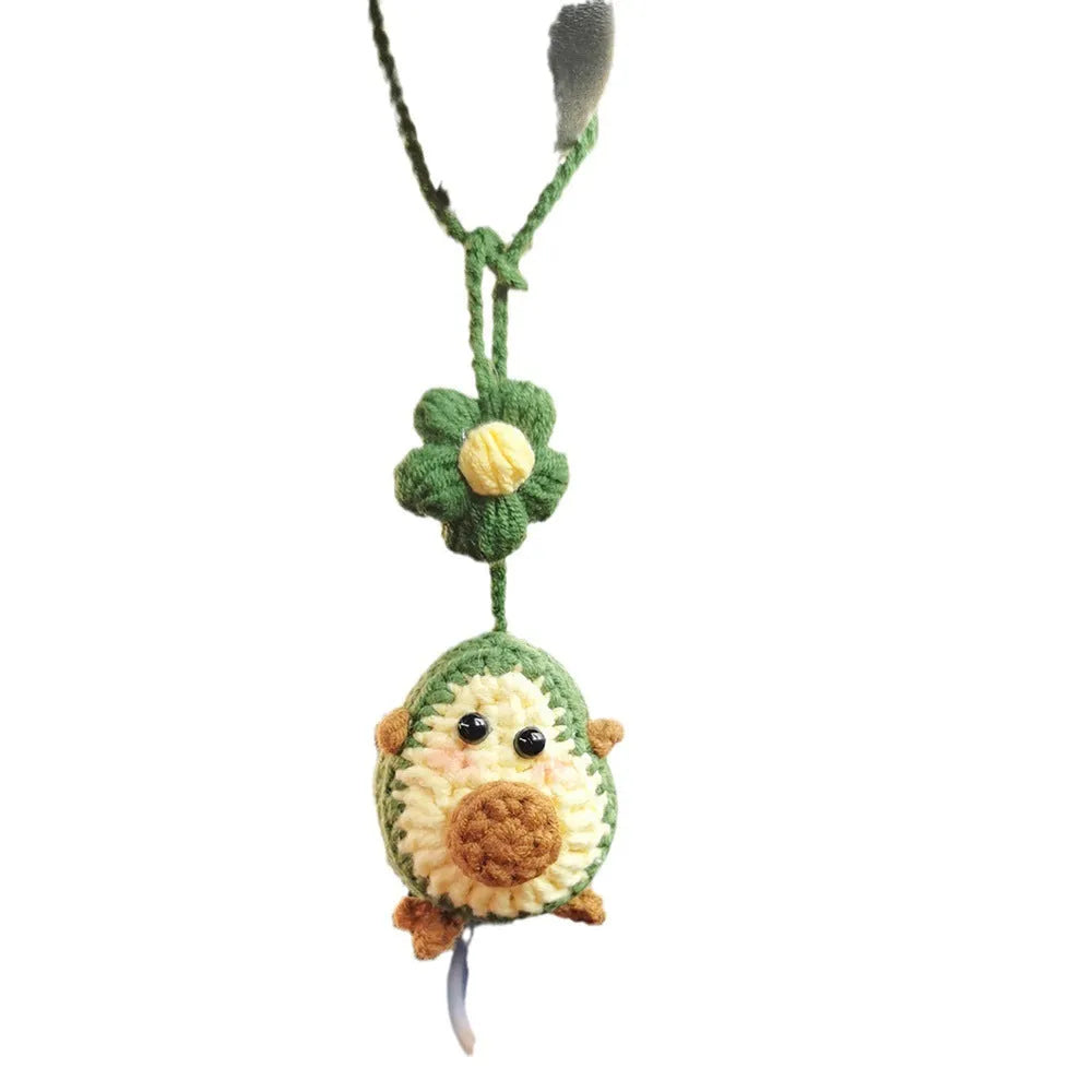 Handmade crocheted avocado car pendant with rainbow flower design in wool material