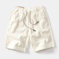 Men's khaki retro cargo shorts with straight leg and multiple pockets