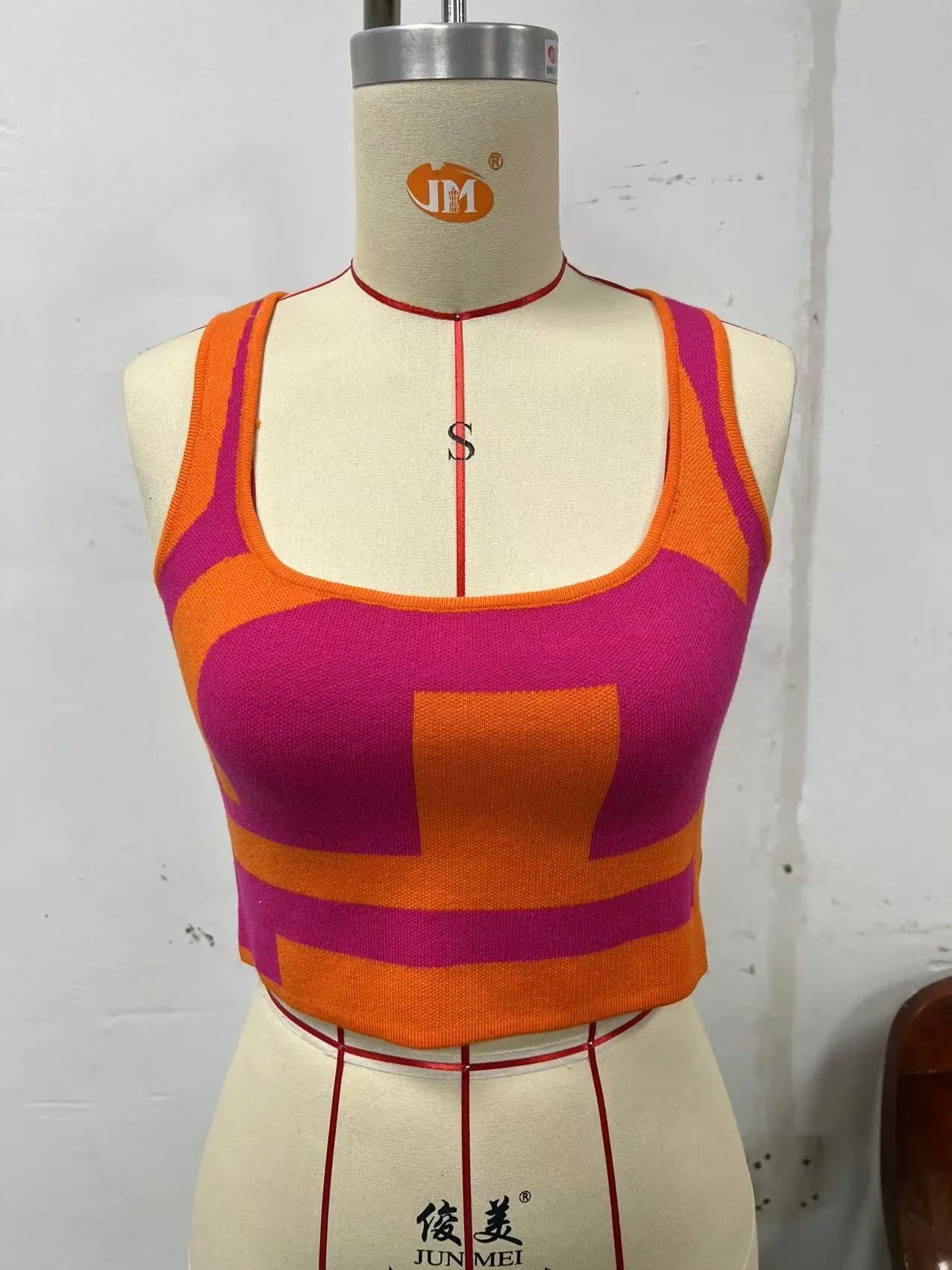 Women's slim fit U collar camisole vest in core-spun polyester, shown in a grass green colour.