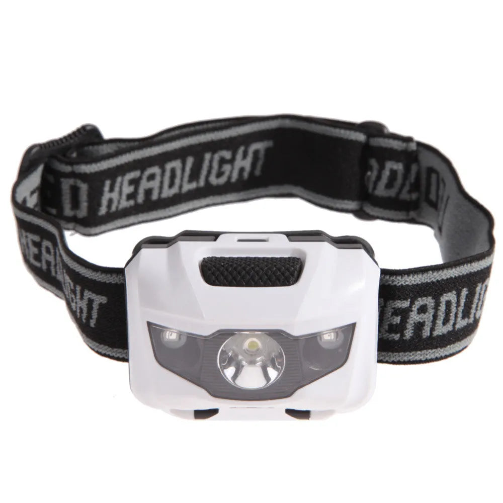 Black waterproof head torch with white and red LEDs mounted on adjustable headband for outdoor use.