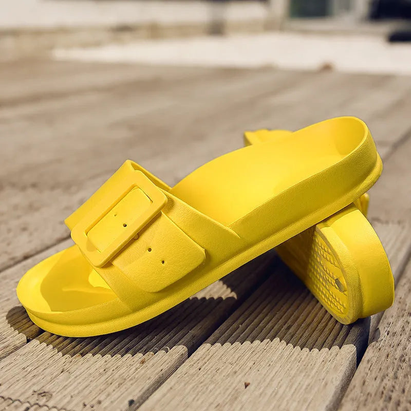 Women's grey blue EVA flip-flops with a buckle strap on a soft sole.