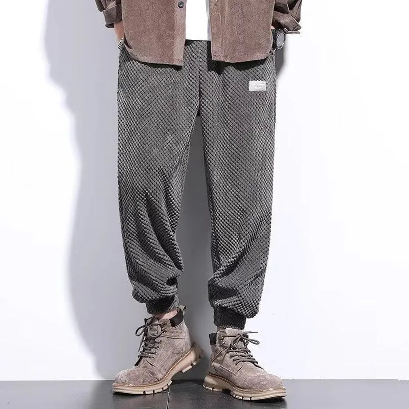 Grey men's straight leg sweatpants with an ankle strap tie detail