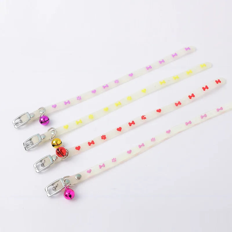 Glow in the dark cat collar with adjustable chain in paw print, love, fishbone, or footprint design.
