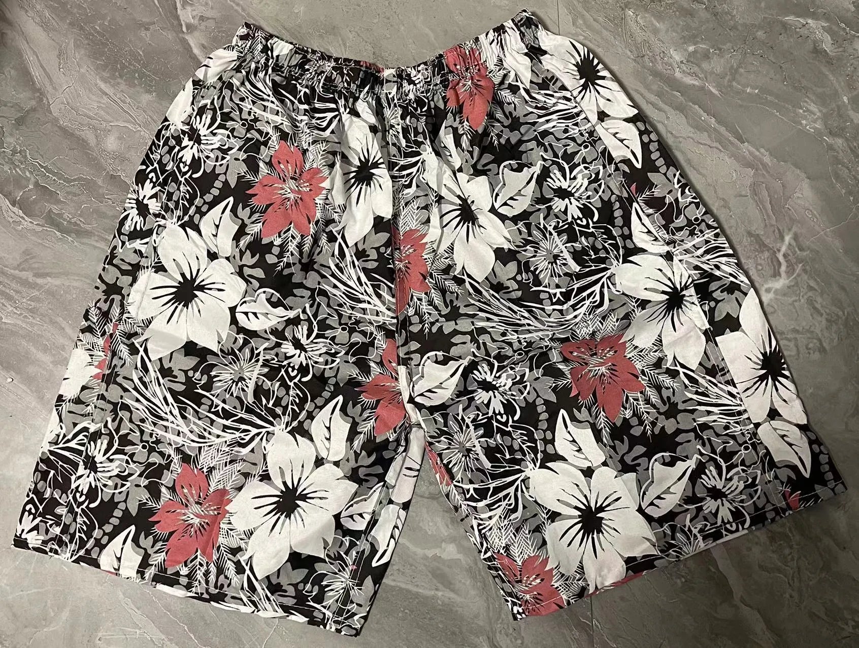 Men's floral print swimming trunks in multiple colour variations for pool and beach wear