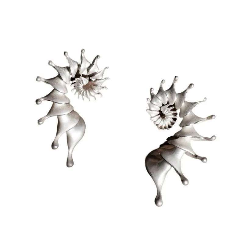 A pair of conch-shaped stud earrings with a three-dimensional matte finish in an irregular simple style.