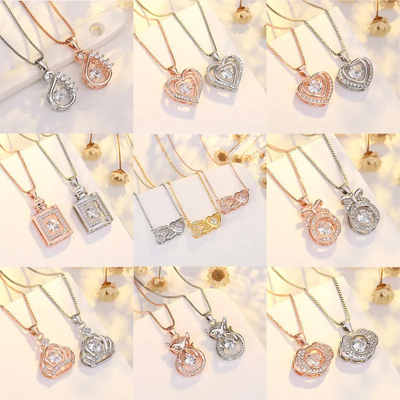 Silver heart-shaped pendant necklace with a crown and bow design on a sterling silver chain.
