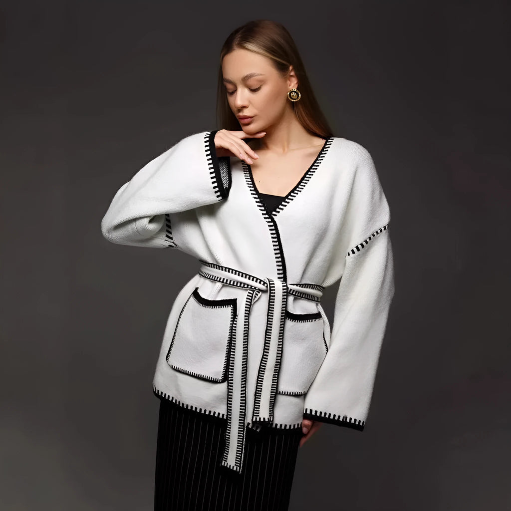 Lace-up front knitted cardigan in camel colour showing loose mid-length design and long sleeves