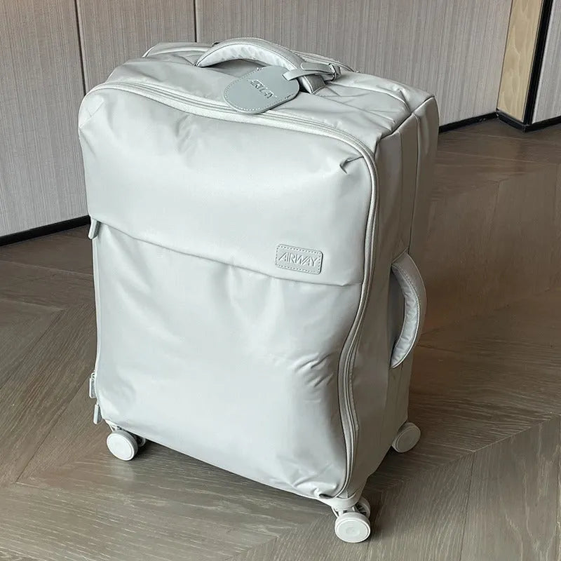 Ultra-light waterproof Oxford cloth suitcase with universal wheels in bluestone green colour.