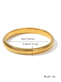 Close-up of a women's elastic titanium steel bracelet featuring a bold vertical stripe ring pattern in a gold tone finish.