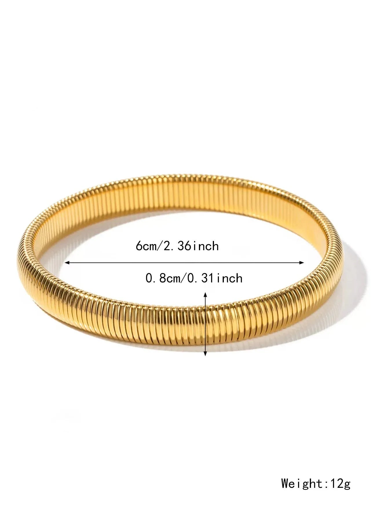 Close-up of a women's elastic titanium steel bracelet featuring a bold vertical stripe ring pattern in a gold tone finish.