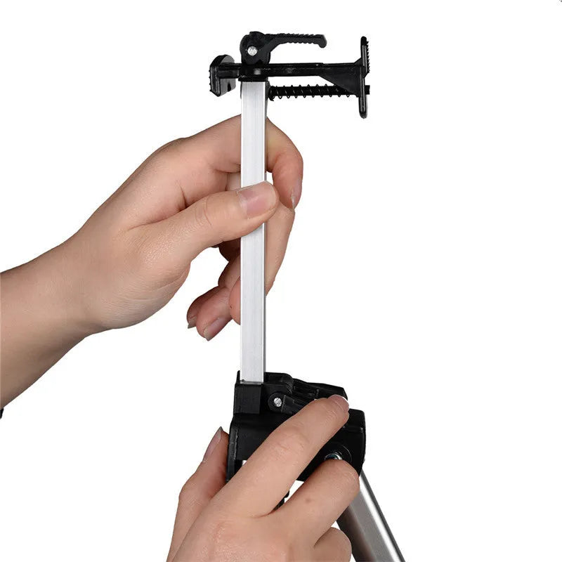 Silver aluminium alloy adjustable painting easel on floor with canvas, folded length 21 inches