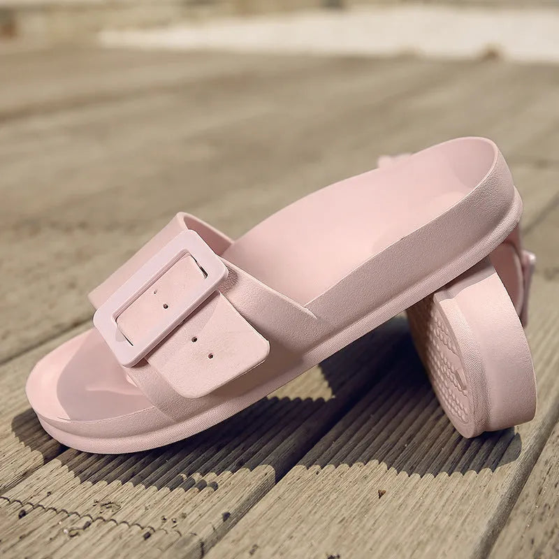 Women's grey blue EVA flip-flops with a buckle strap on a soft sole.