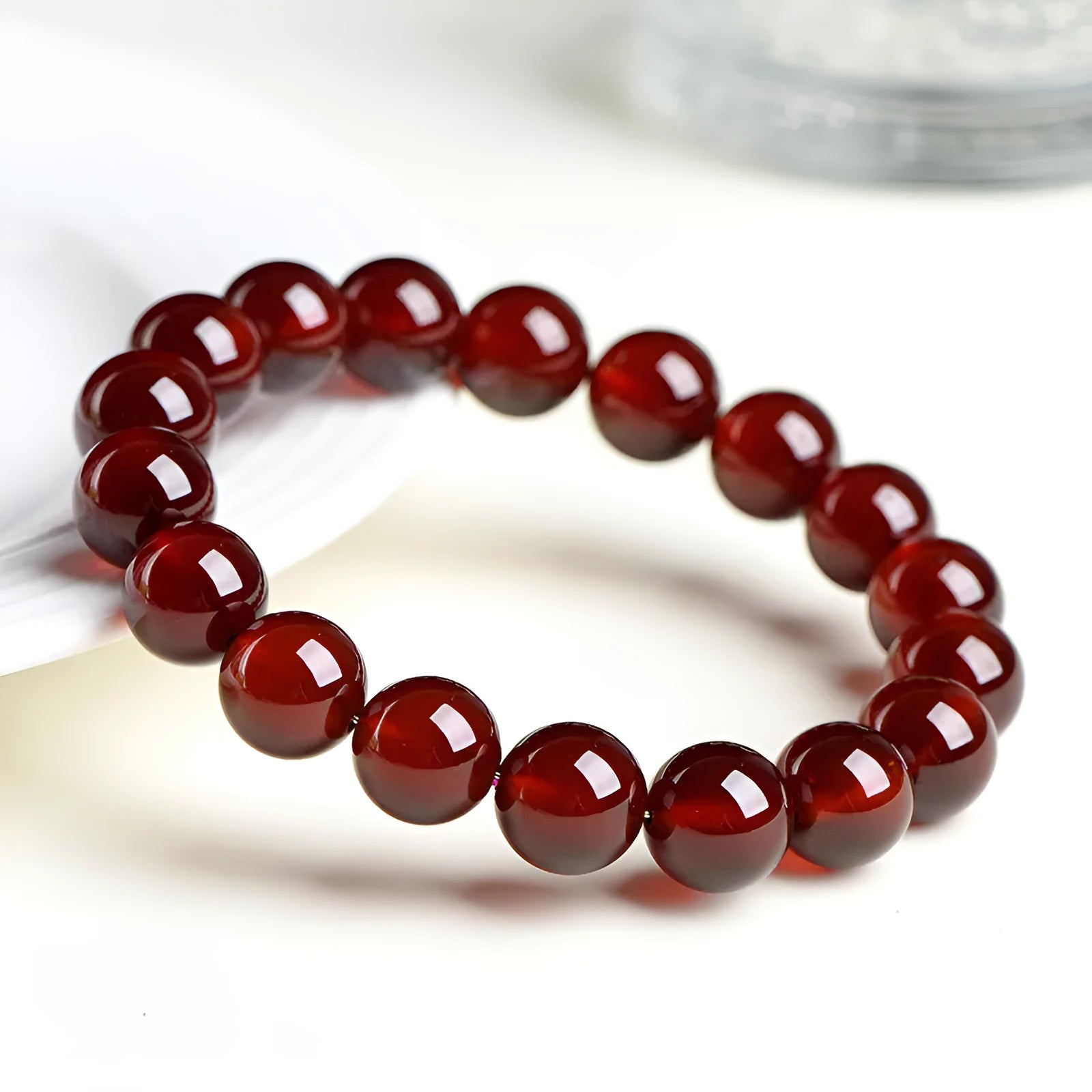 Natural orange red garnet crystal ball bracelet with retro Ruyi design and unisex styling
