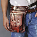 Small black genuine leather men's punk-style fanny pack worn on waist with zipper open